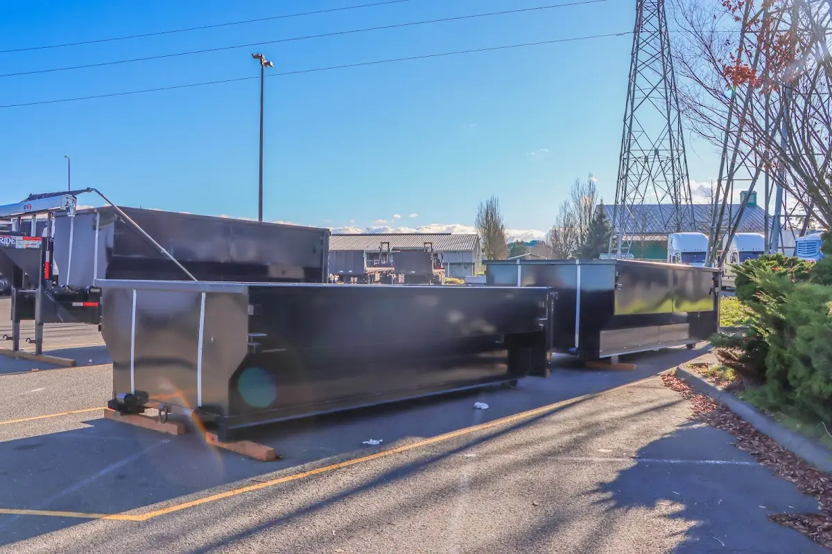Roll-off dumpster ready for waste disposal at job site for Concrete Dumpster Rental in Norwalk